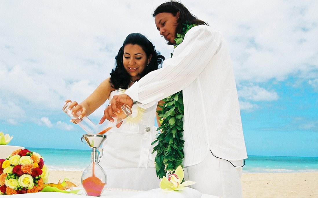 orange and red color the bride and groom on oahu